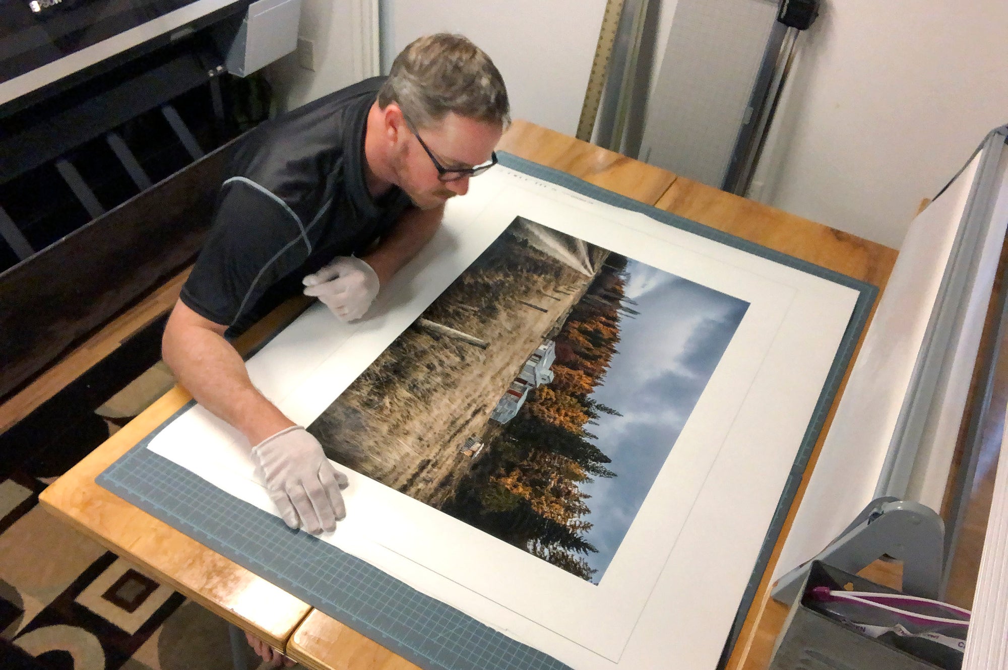 Tadd Myers inspecting the print