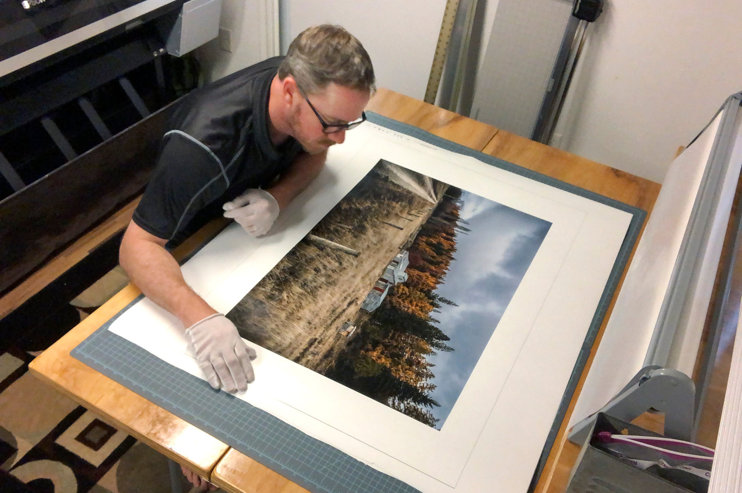 Tadd Myers inspecting the print