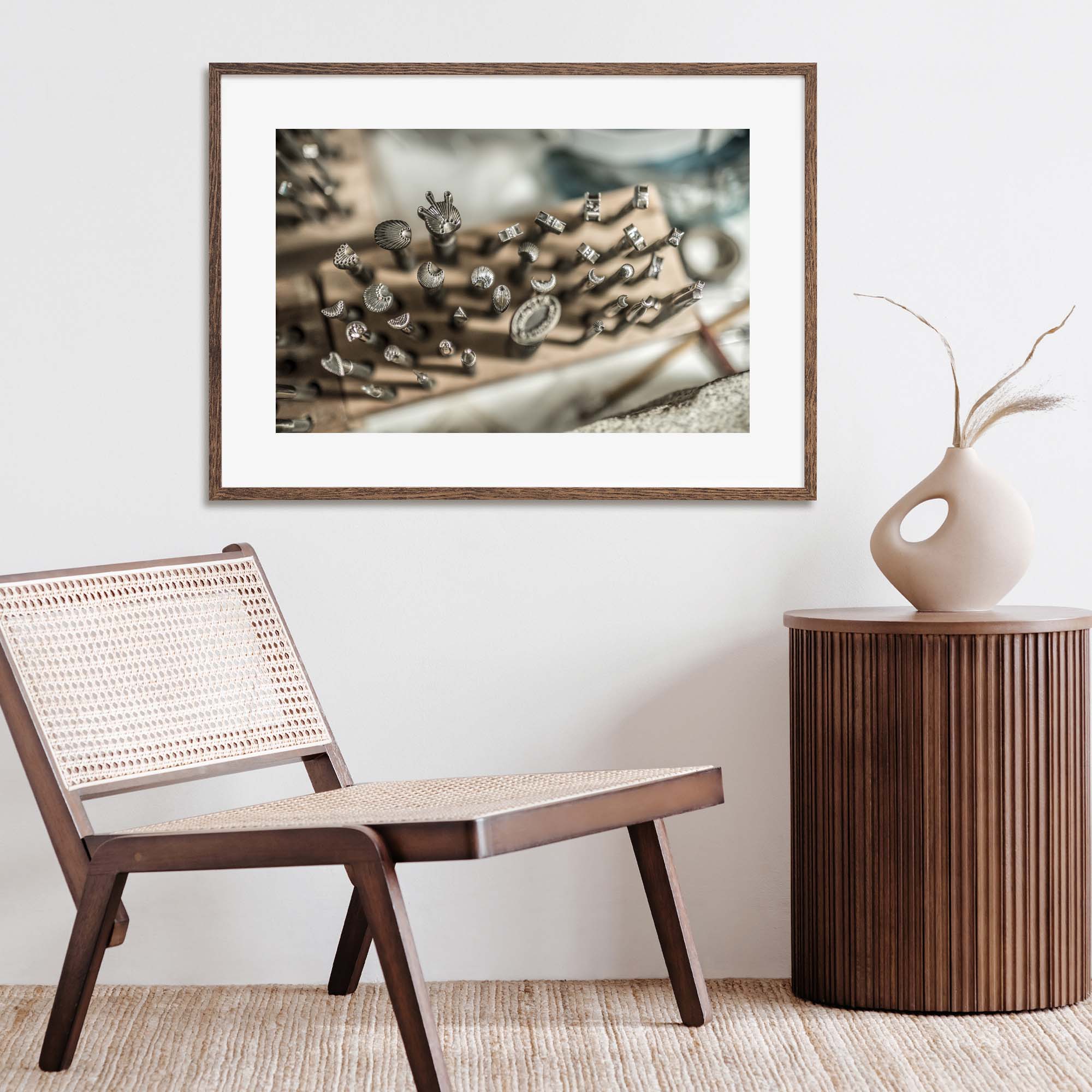 Collection of metal stamps on a wooden block with a blurred background for bootmaking, photo by Tadd Myers