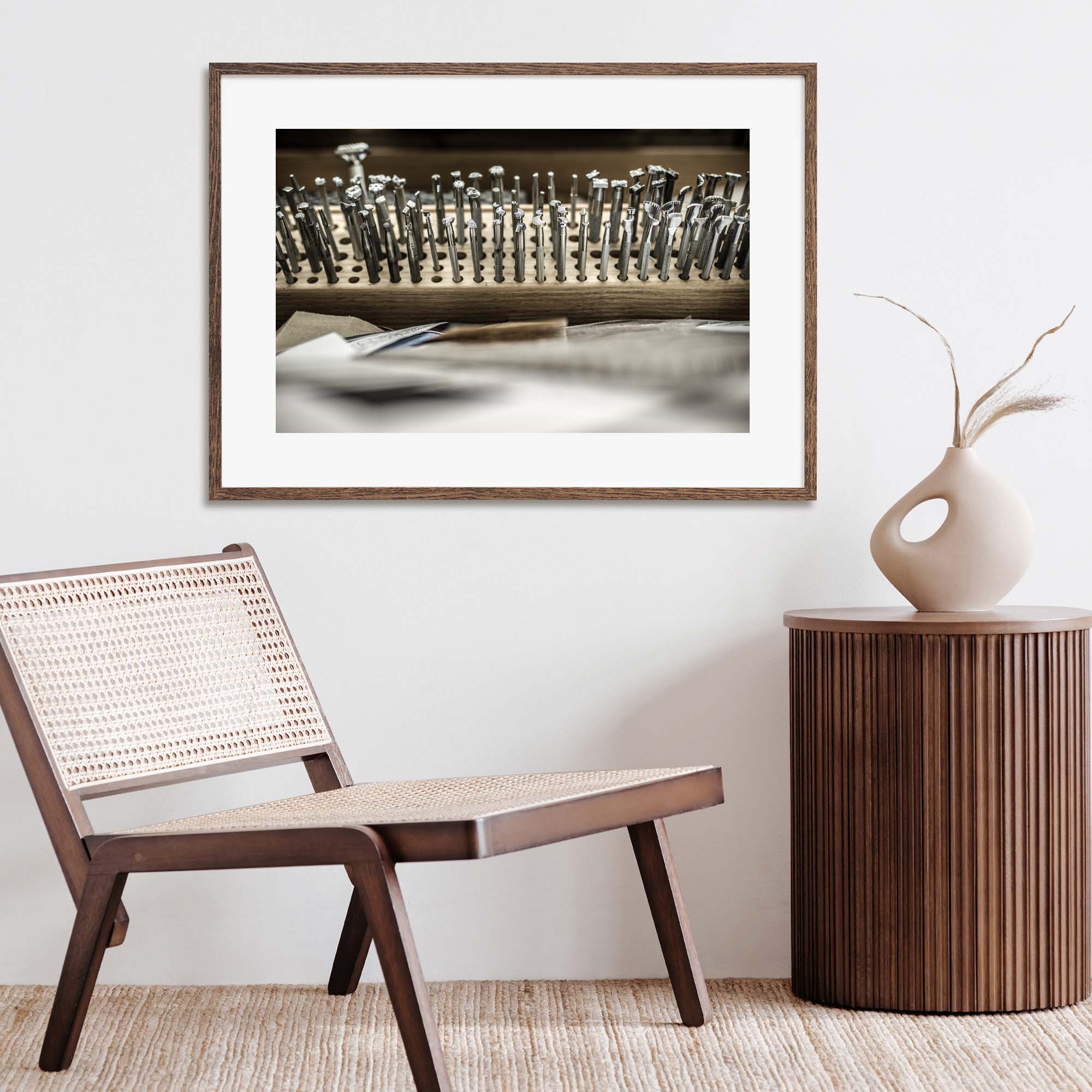 Tadd Myers, Making Boots tools and designs photo displayed on the wall